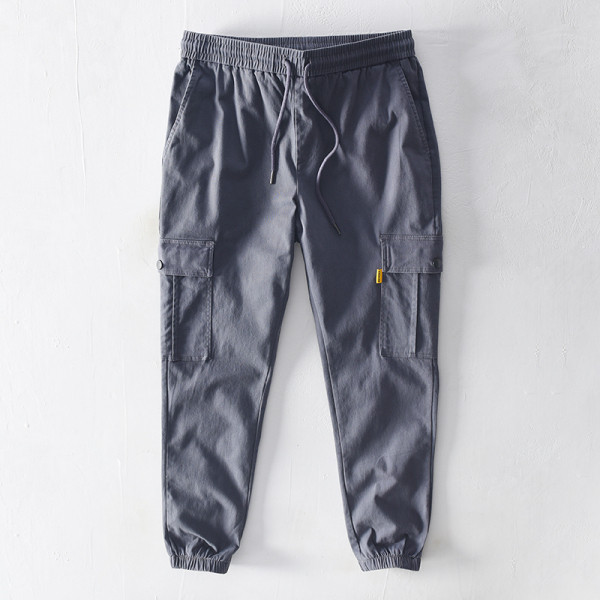 Vīriešu bikses ar elastīgu jostasvietu un sānu kabatām