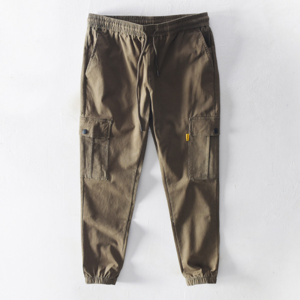 Vīriešu bikses ar elastīgu jostasvietu un sānu kabatām