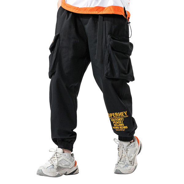 Modernas vīriešu bikses ar lielām kabatām un uzrakstu