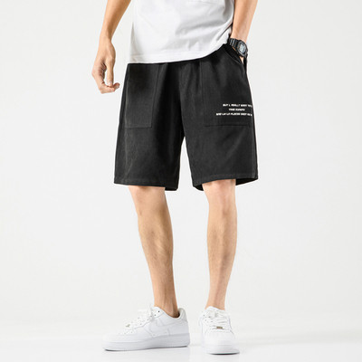 Taskute ja kirjaga meeste spordipüksid