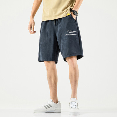 Taskute ja kirjaga meeste spordipüksid