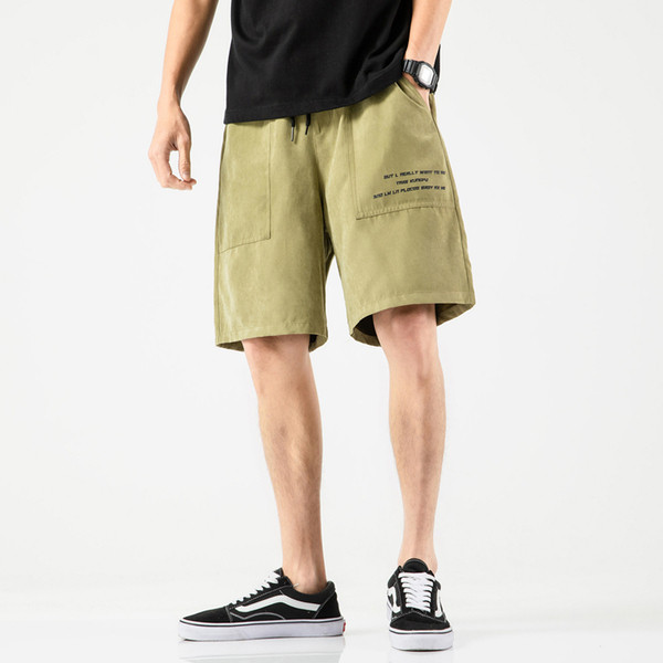 Taskute ja kirjaga meeste spordipüksid