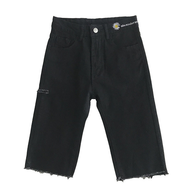 Naiste püksid pikkusega 3/4 ja tikandid