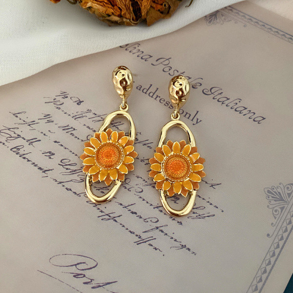 Naiste rippuvad päevalilledega kõrvarõngad