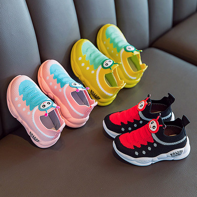 Casual children`s sneakers with flat soles and colorful applique