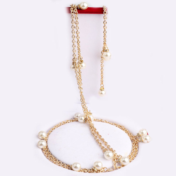 Kuldset värvi pärlite ja kivikestega naiste vöö