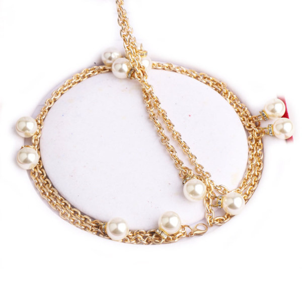 Kuldset värvi pärlite ja kivikestega naiste vöö