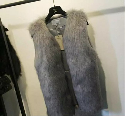 Elegáns, hosszú női mellény pehellyel