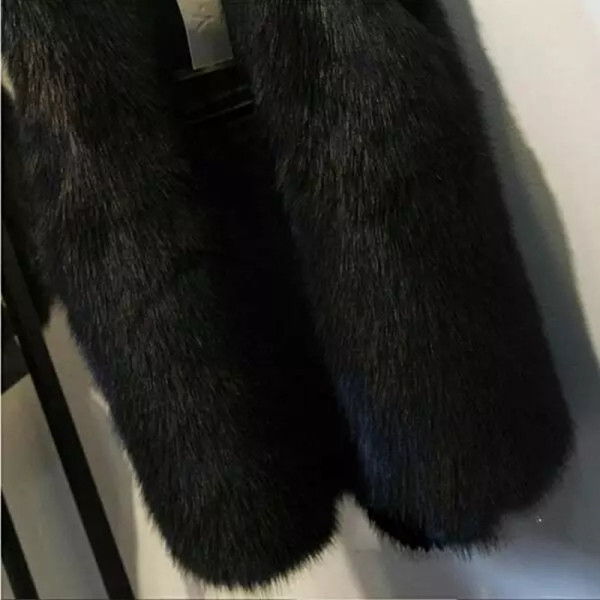 Eleganta sieviešu garā veste ar dūnām