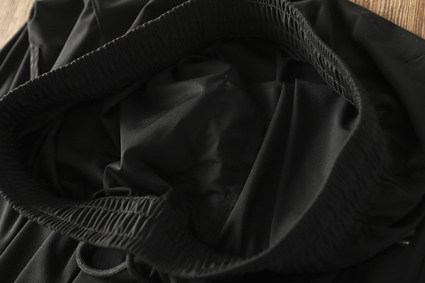 Meeste mustad vabaaja püksid kummikuga