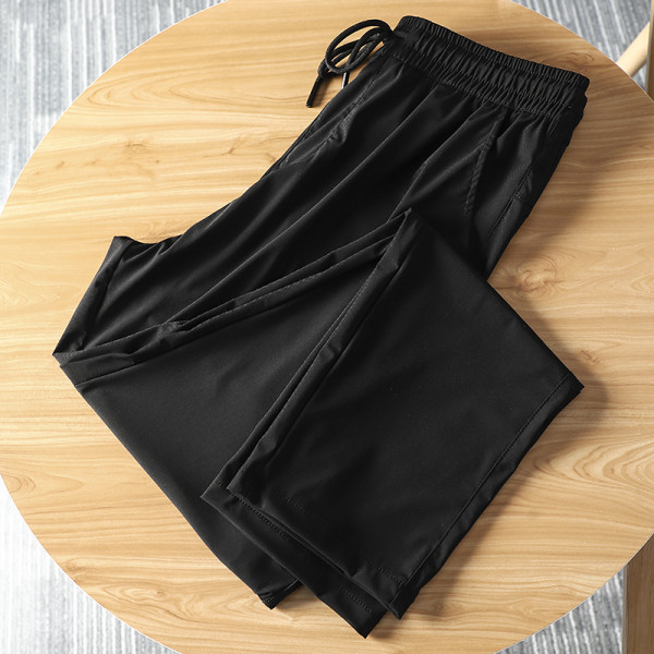 Meeste mustad vabaaja püksid kummikuga