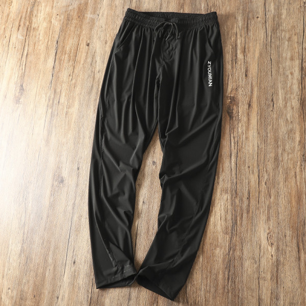 Meeste mustad vabaaja püksid kummikuga