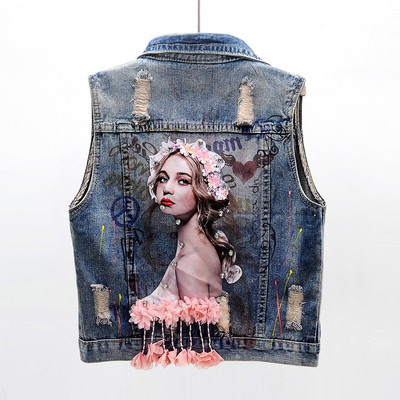 Κομψό γυναικείο γιλέκο με τζιν με απλικέ και τρισδιάστατο στοιχείο