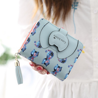 Női pénztárca bojttal és színes rátéttel