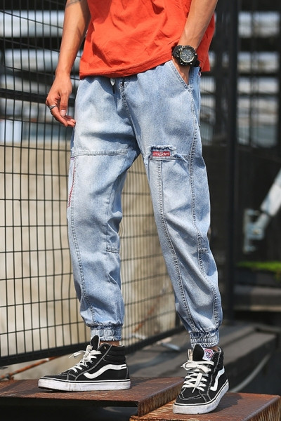 Νέο μοντέλο μακρύ τζιν με τσέπες και σχισμένο δεξιά