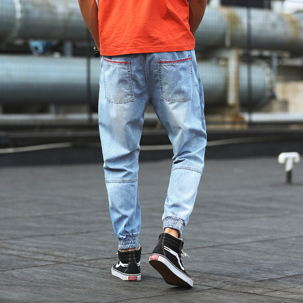 Νέο μοντέλο μακρύ τζιν με τσέπες και σχισμένο δεξιά