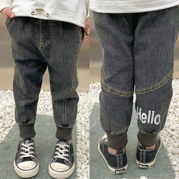 Μοντέρνα παιδικά μακριά τζιν με ελαστικό στον αστράγαλο και επιγραφή σε γκρι χρώμα