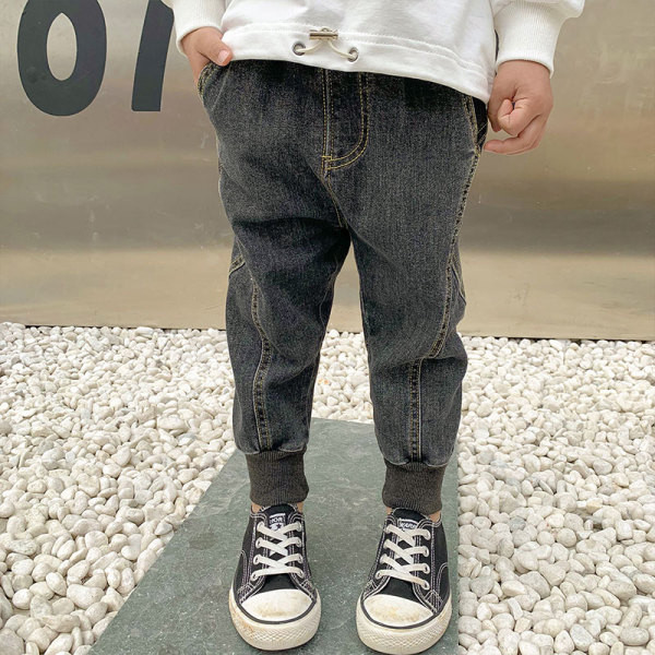 Μοντέρνα παιδικά μακριά τζιν με ελαστικό στον αστράγαλο και επιγραφή σε γκρι χρώμα