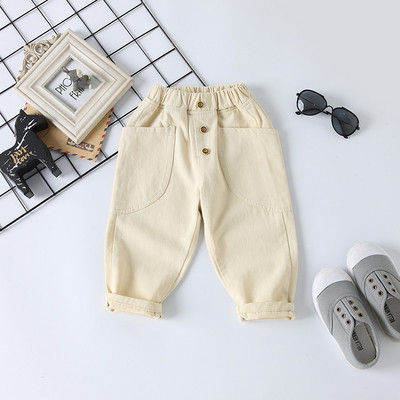 Modern hosszú farmernadrág, gombokkal és zsebekkel