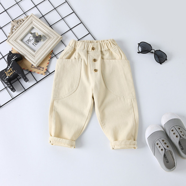 Modern hosszú farmernadrág, gombokkal és zsebekkel