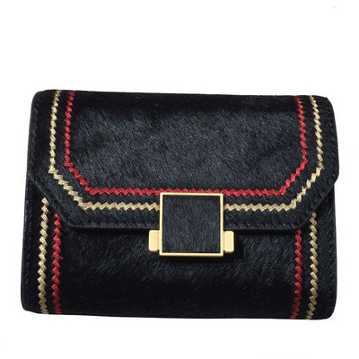 Naiste rahakott metallist kinnituse ja tikandiga