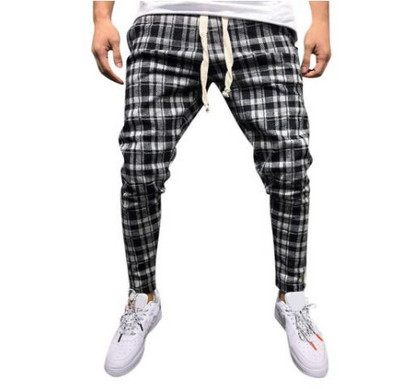 Moodsad meeste pikad ruudulised taskute ja ääristega püksid