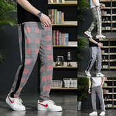 Divatos férfi hosszúnadrág fekete szegéllyel