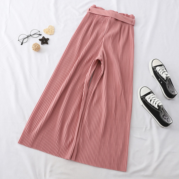 Naiste plisseeritud püksid kõrge vöökoha ja lipsuga