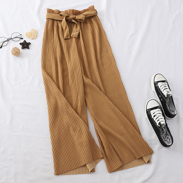 Naiste plisseeritud püksid kõrge vöökoha ja lipsuga