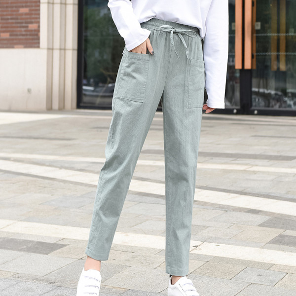 Kõrge vöökoha ja lipsudega vabaaja naistepüksid