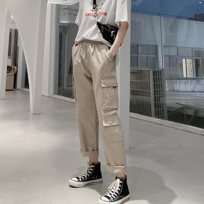 Női nadrág zsebekkel és rugalmas derékkal - széles modell