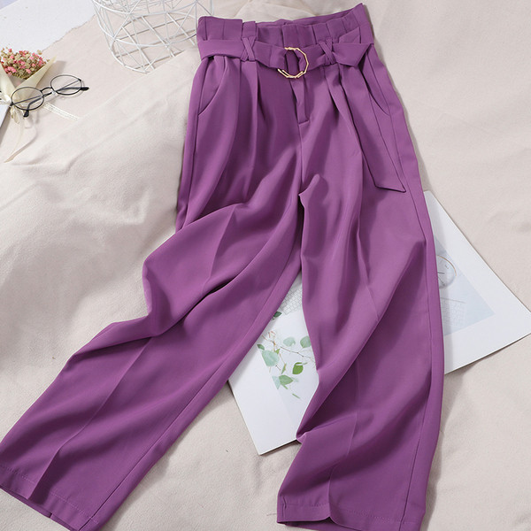 Modernas sieviešu bikses ar augstu vidukli un metāla riņķiem