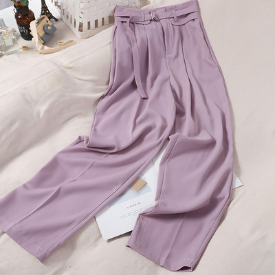 Modern női nadrág övvel és magas derékkal