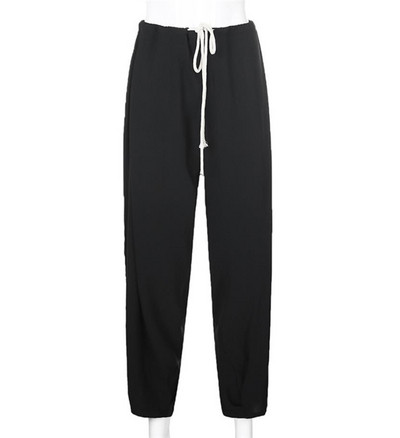 Női nadrág nyakkendővel, magas derékkal