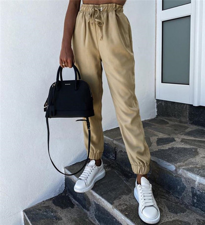 Modern női nadrág elasztikus derékkal és megkötővel