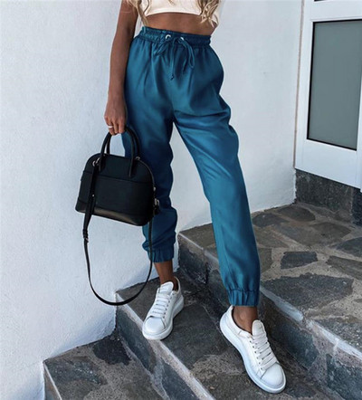 Modern női nadrág elasztikus derékkal és megkötővel