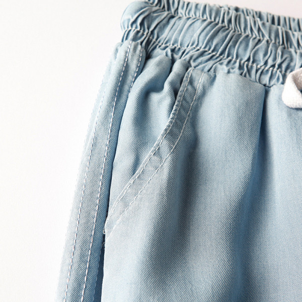 Alkalmi női nadrág szegéllyel és gumírozott derékkal