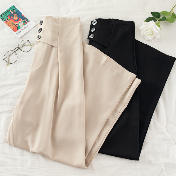 Női nadrág magas derékkal és gombokkal - széles modell