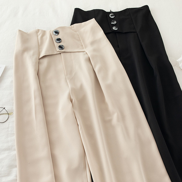 Női nadrág magas derékkal és gombokkal - széles modell