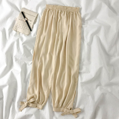 Modern női nadrág elasztikus derékkal és megkötővel