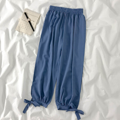 Modern női nadrág elasztikus derékkal és megkötővel