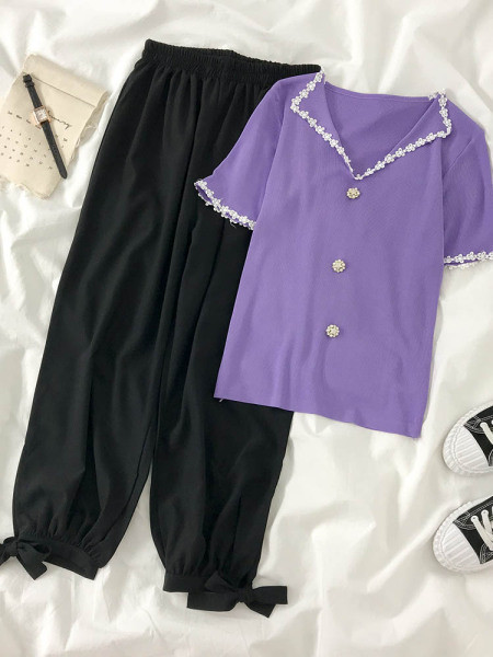 Modern női nadrág elasztikus derékkal és megkötővel