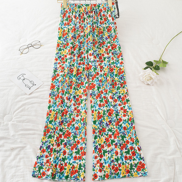 Redős női nadrág virágmintával és gumírozással