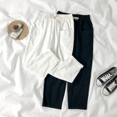 Sieviešu bikses ar elastīgu jostasvietu un kabatām divās krāsās