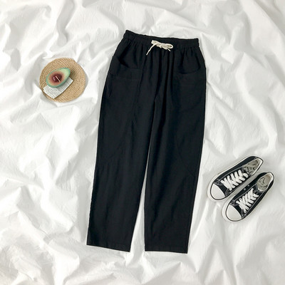 Sieviešu bikses ar elastīgu jostasvietu un kabatām divās krāsās