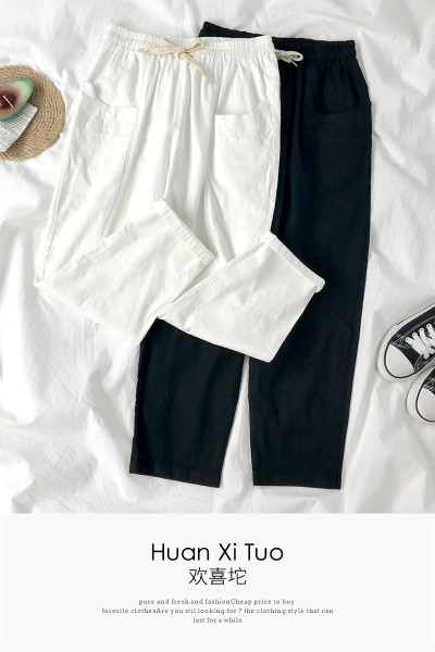 Sieviešu bikses ar elastīgu jostasvietu un kabatām divās krāsās