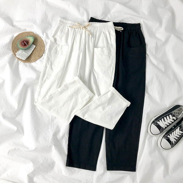 Sieviešu bikses ar elastīgu jostasvietu un kabatām divās krāsās