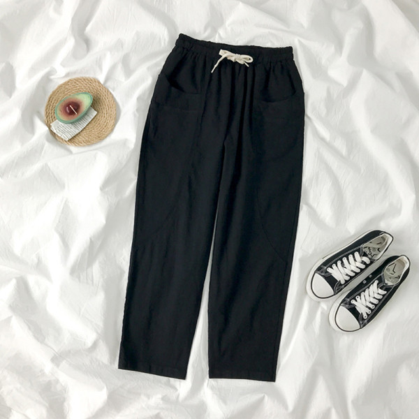 Sieviešu bikses ar elastīgu jostasvietu un kabatām divās krāsās