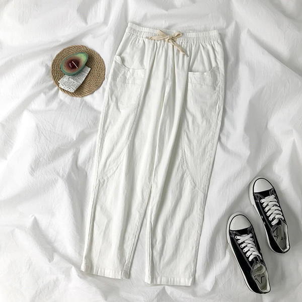 Sieviešu bikses ar elastīgu jostasvietu un kabatām divās krāsās