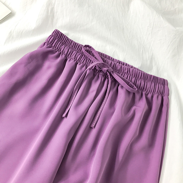 Női alkalmi nadrág nyakkendővel és gumis derékkal